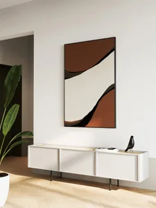A minimalist living room featuring clean lines, organized decor, and a white color scheme with accent pieces in darker tones.