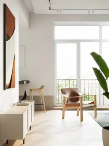 A modern minimalist living room with a large window, wooden chair, and leather accents.
