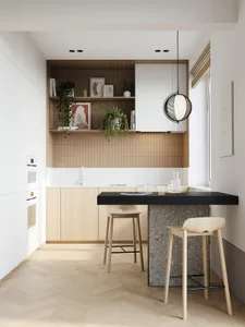 Contemporary kitchen featuring wooden cabinetry, concrete countertops, and metal accents