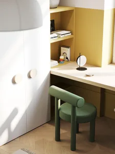 A modern office desk space featuring wooden furniture and a green upholstered chair.