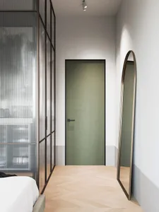 Modern minimalist bedroom featuring wood flooring, glass walls, metal accents, and painted walls