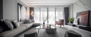 A modern minimalist living room with a fabric sofa, glass table, and minimalist decor.