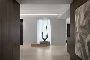 Modern minimalist living room featuring marble and wood