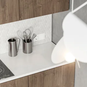 A modern kitchen featuring metallic containers and concrete countertops against a wooden cabinet background.