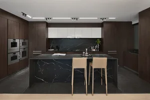 Modern residential kitchen featuring black granite countertops and marble furniture.