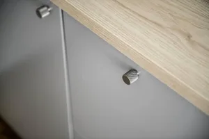 Modern kitchen with a wooden base cabinet and metal handle