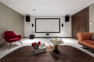 A contemporary movie theater with a marble floor and interior design features.