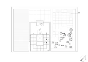 A floor plan of a modern office layout made on paper.