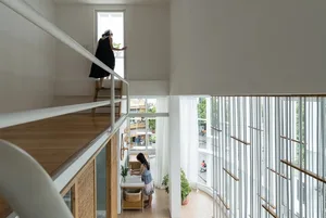 A modern residential interior featuring a combination of wooden and metallic elements.