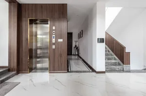 A modern lobby featuring marble flooring and interior design elements.