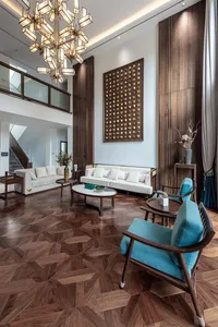 Modern living room featuring a combination of marble and wooden elements.