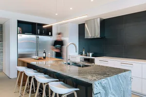 Modern kitchen featuring a sleek, luxurious countertop crafted from high-quality quartzite.