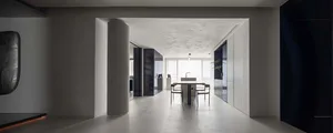 A minimalist residential interior featuring modern materials and a sleek, open layout.