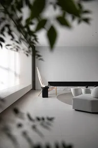 Modern minimalist living room featuring minimalist furniture and concrete floor.