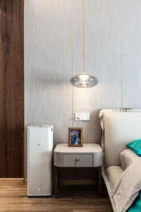 A modern bedroom featuring decorative elements made of wood and textile materials.