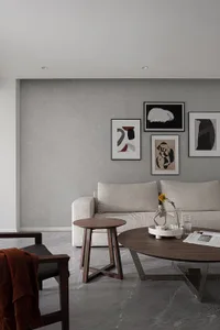 A modern minimalist living room featuring fabric furniture, wood and metal accents, and a cozy atmosphere.