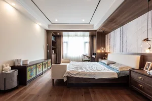 A modern bedroom with a wooden floor, a cozy bed, and a wooden headboard.