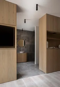 A modern bathroom featuring a concrete sink and walls.