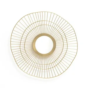 Modern wall art featuring a circular metal grid design.