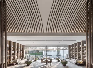 A contemporary minimalist hotel lounge featuring modern furniture and a sleek design.