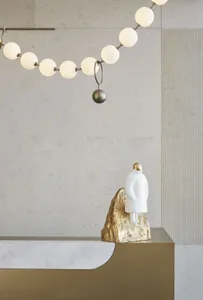 A minimalist interior space featuring concrete and marble elements.