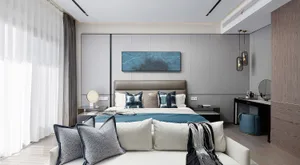 A contemporary bedroom with a bed, nightstands, and decorative pillows.