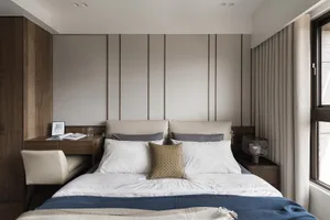 Modern bedroom featuring fabric, wood, and metal elements.