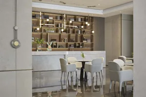 Modern cafe interior with marble accents and concrete flooring