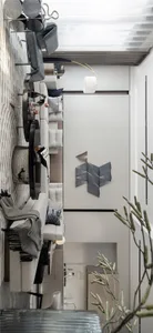 A modern living room with textured fabrics and a minimalist design.