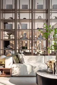 Modern living room with a white sofa, wooden shelves, and decorative items.