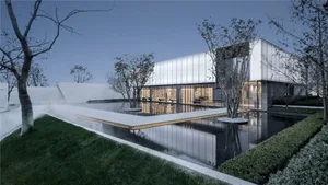 A modern minimalist house exterior featuring glass and concrete materials in a serene setting.