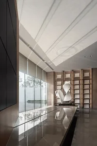 Modern office entryway with metal, glass, and concrete materials.