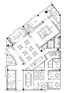 A detailed 2D architectural drawing of an office layout made on paper.