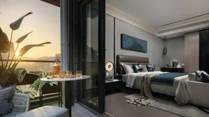 A modern bedroom with a balcony featuring a tropical plant.