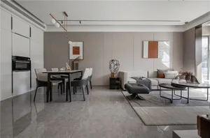 A modern interior with white marble flooring, minimalist furniture, and abstract wall art.