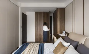 A modern minimalist bedroom with fabric, wood, and metal materials.