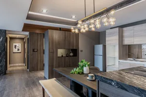 Modern residential kitchen featuring wood and marble finishes