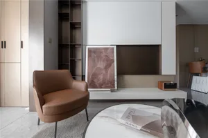 A modern living room featuring contemporary furniture, a minimalist design, and a sleek, white coffee table.