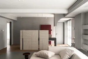 Modern living room interior featuring polished concrete tiles, minimalist furniture, and a sleek, contemporary design.