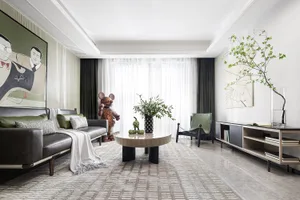 Modern lounge area featuring furniture with concrete, glass, and leather finishes.