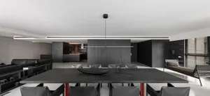 Modern dining room with stone table and minimalist design.