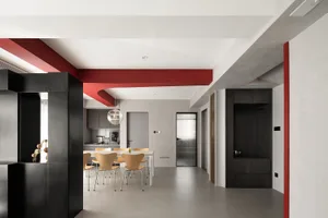 Modern interior design with black cabinets and red accents