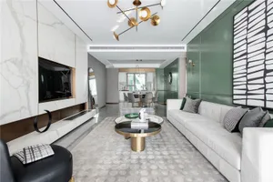 A modern minimalist living room with a marble fireplace, a textured white sofa, and a metal coffee table.