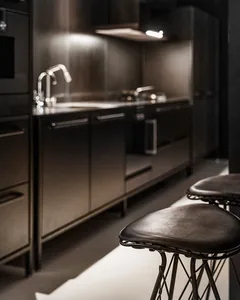 Modest, metallic modern residential kitchen