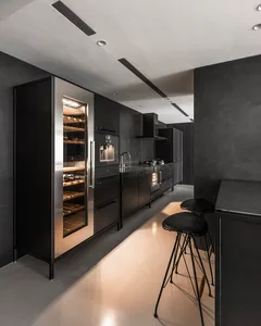 A sleek, contemporary kitchen with metallic cabinets and stainless steel appliances.