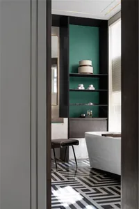 Modern bathroom with marble floor and fixtures.