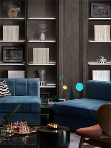 Modern living room with blue sofas, minimalist decor, and a mix of textures and materials.