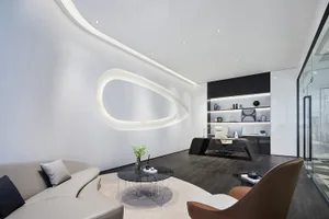 Modern minimalist office space with glass elements and sleek furniture.