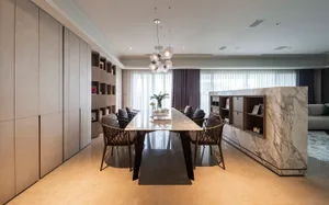 Modern dining room featuring marble table, wooden chairs, and glass chandelier.