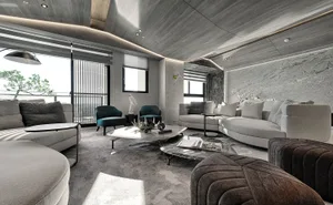 Modern living room featuring mixed materials with gray and black accents.